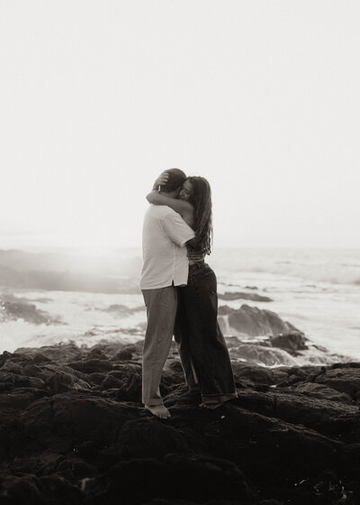 destination elopement photography  in hawaii bride and groom hugging eloping on the beach