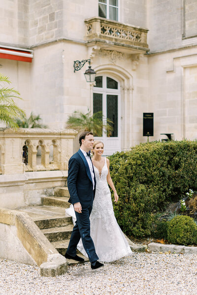 Kevin and Kayla walking at their wedding at a French chateau in Bordeaux
