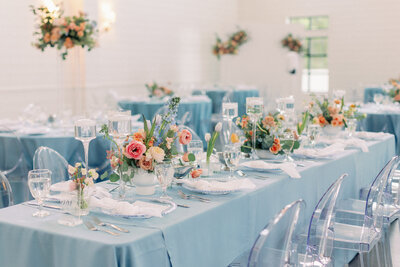 Bright pink, orange and fuchsia florals designed for a wedding centerpiece