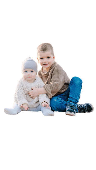 Little boy and baby together near the Eiffel Tower at Trocadéro during a Paris family photoshoot