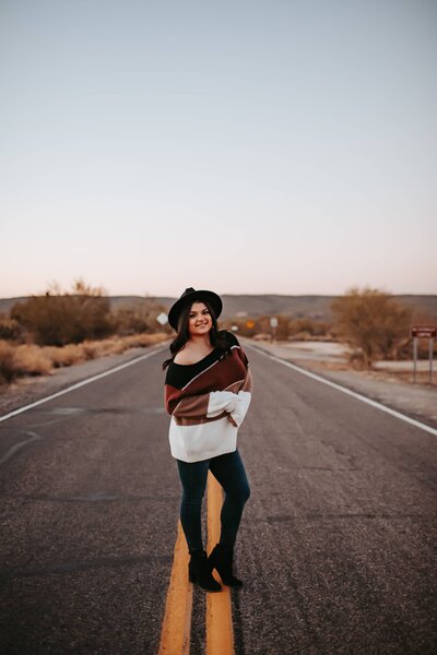 woman influencer standing on road