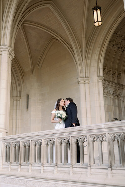 bride and groom posing at the national cathedral in washington dc
