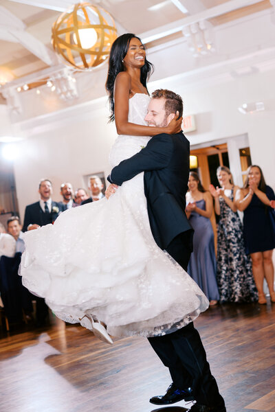 Bride and groom dancing on checkboard dance floor at Glen Foerd Estate in Philadelphia, PA