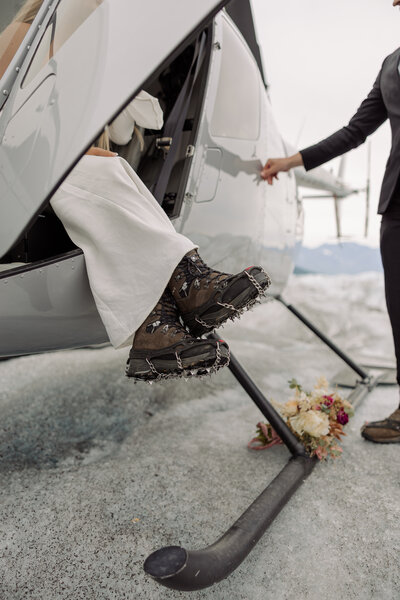 Wearing spikes on your hiking boots while eloping in Alaska on a glacier is a must