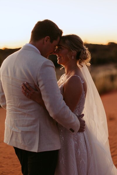 Couple eloping at Uluru at sunset