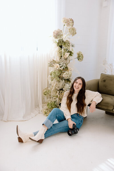 A oklahoma wedding photographer smiling for a portrait.