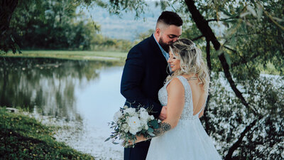 Groom kisses bride on the forhead at the Sablewood near Albany New York