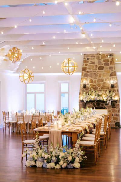 Bright floral centerpieces mixed with colorful fruit at Glen Foerd Estate in Philadelphia, PA