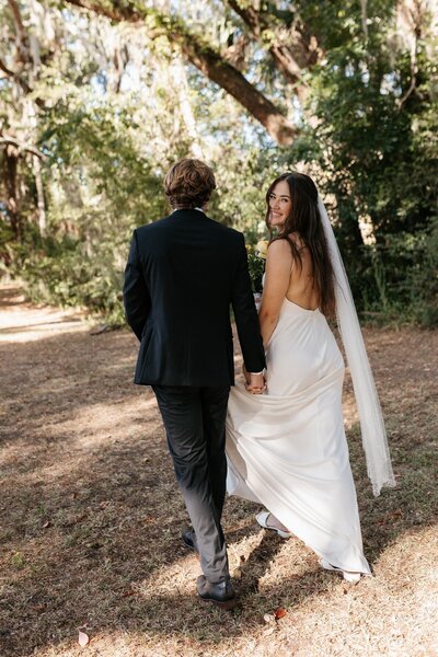 indie west photo portfolio image of bride and groom walking on wedding day