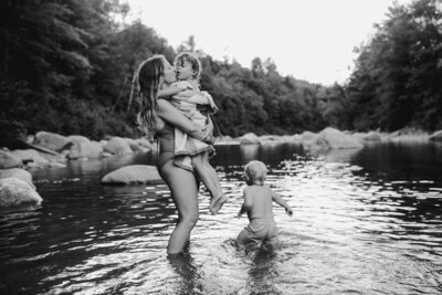 Mother and father looking at baby in crib at Austin family photo session