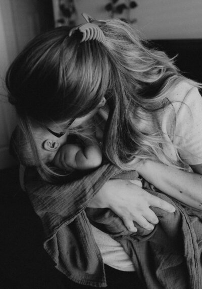 mother holding her newborn baby
