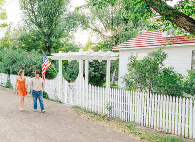 a couple walking and holding hands 
