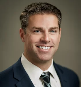 Executive headshot of senior businessman in gray suit in NYC office by Alex Kaplan Photo