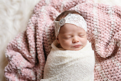 Beautiful Mississippi Newborn Photography: baby girl wrapped with ivory headband