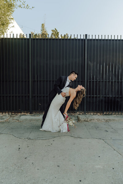 Engaged Couple standing inside glass house taken by Orange County wedding photographer Mikey Mora Photography