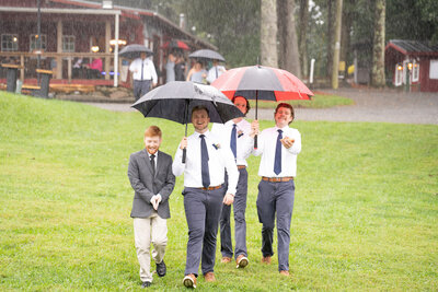 Bride and groom walking down the isle after they kiss and say I do at  Historic Tuckahoe in Richmond, VA.