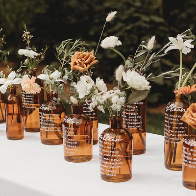 Glass bottle  seating chart for wedding at Chatfield Hollow Inn in Connecticut