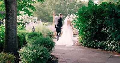 Bride and groom kissing during first dance