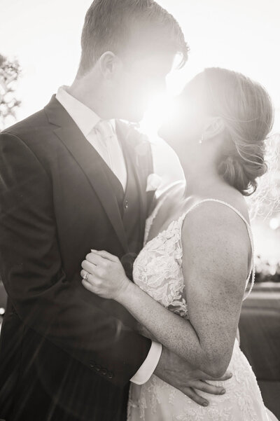 Oshkosh wedding photos of couple at sunset nose to nose