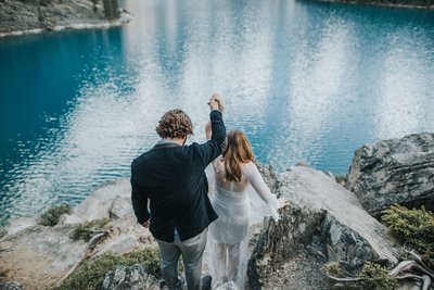 Steven and Steph walk down a mountain at moraine lake