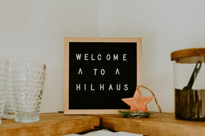 Welcome sign inside of cabin.