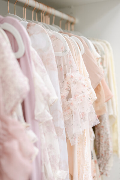 A rack of pastel dresses