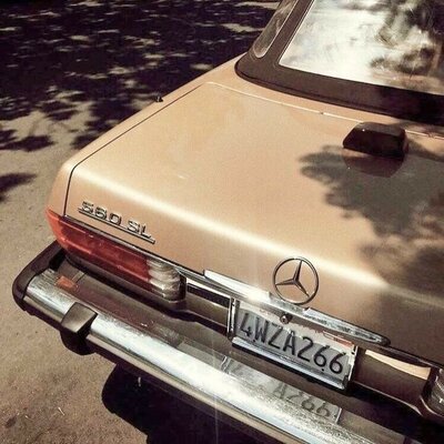 Image showcasing the rear of a vintage car, potentially representing a sense of timeless beauty and classic style associated with The Complexion Club, a skincare club with an aesthetic-forward website.