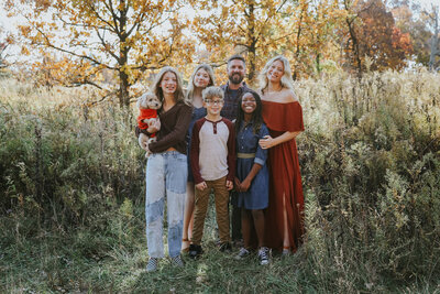 family jumping and smiling