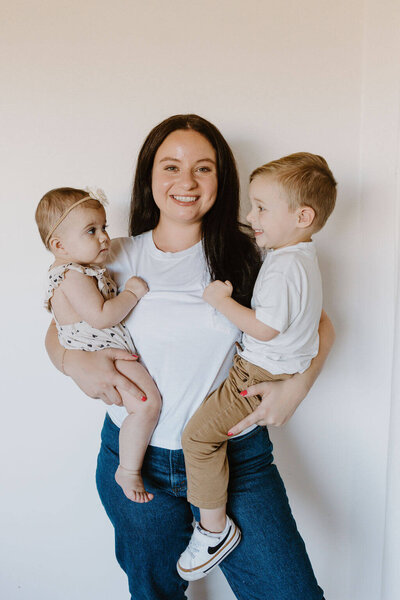 women holding children