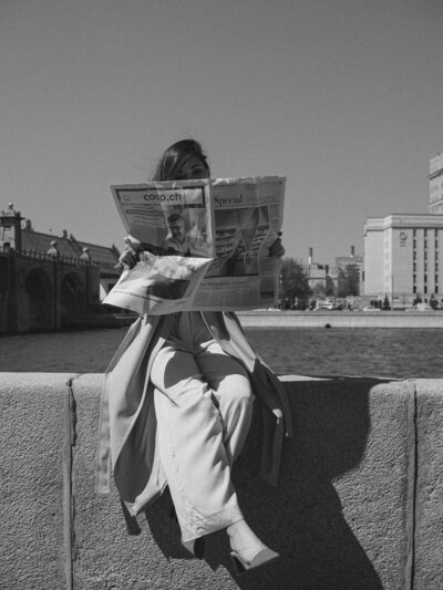 Merrit texting on phone to client