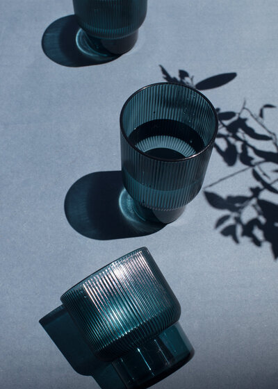 Two glasses on top of a table, symbolizing connection and harmony.