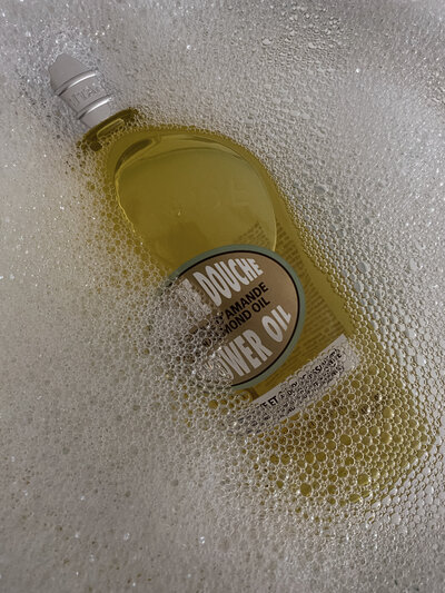 l'occitane body wash, creative product photography, shower oil in bubbles