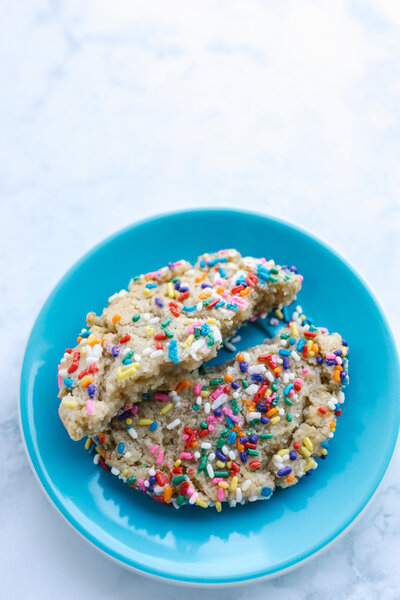 sprinkle cookie on a blue plate