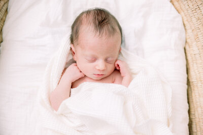 baby wrapped in white blanket for Tampa portrait photographer