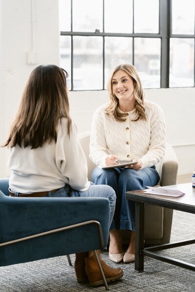 Two ladies speaking to each other