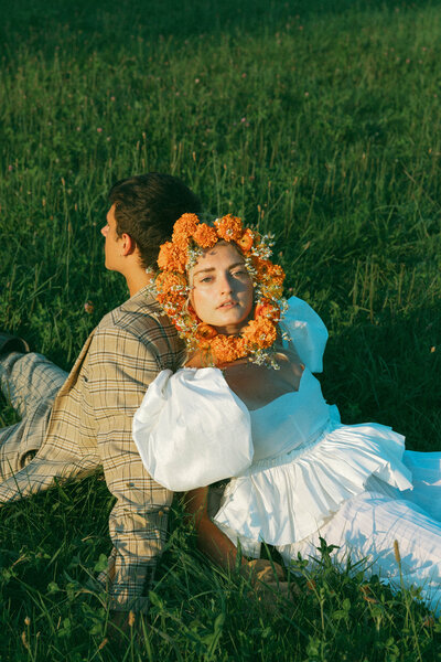 couple sitting on the grass