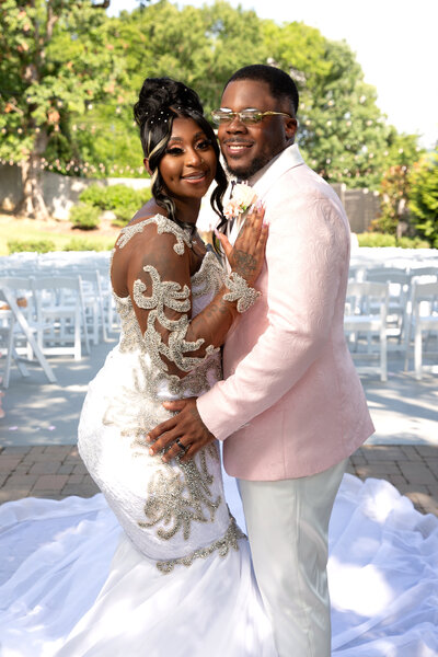 Beautiful newly couples taking portraits in wedding attire at The Venue on Cummings Hwy.