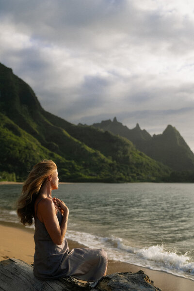 Nicole practicing meditation outdoors in Kauai, showcasing mindfulness, balance, and wellness at Love Light Wellness