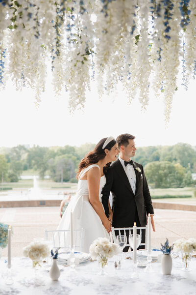 Photo of couple seeing wedding reception for first time at World's Fair Pavilion