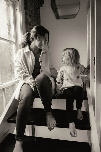 Samantha Schultz kissing her young daughter