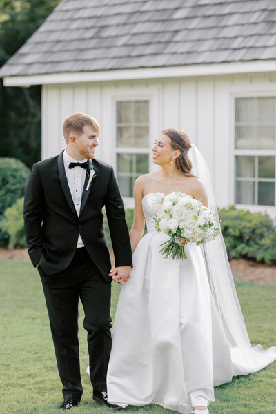 bride hugging groom from behind