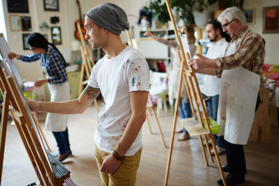 Students taking art classes, trying something new.