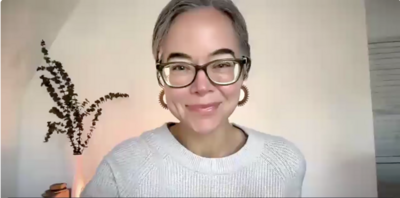Tanner Wallace meeting with a student during a one-on-one CPTSD Medicine Zoom session, seated in a softly lit room with a plant in the background.