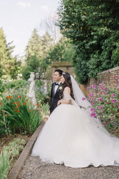 bride and groom garden portraits among flowers