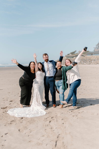 Styled by Daralyn, Mini with Luna Soul esthetics, her fiance, and Ashely and Katelin standing on the coast with their arms all extended.