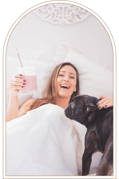 kat in bed with her dog