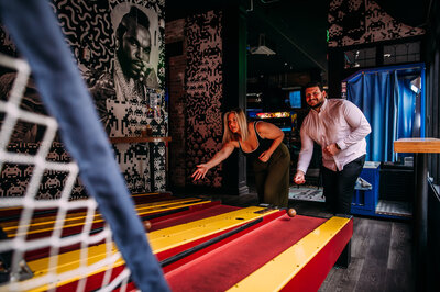 cute couple at an arcade in st louis skeeball 