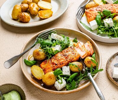 Oven-roasted spiced salmon with baby potatoes, feta and rocket for hormone balance
