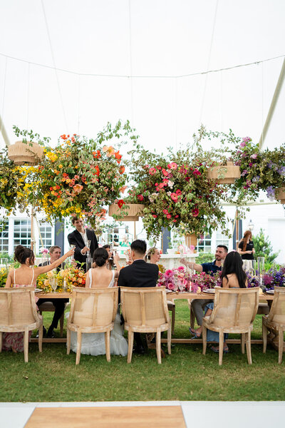 Bride and groom enjoy toasts at their wedding reception in NC