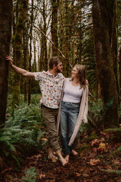 couple-leaning-forest-intimate